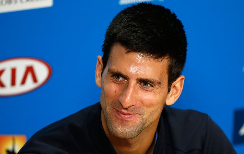 Novak Djokovic of Serbia smiles during a press conference at the Australian Open tennis championship in Melbourne, Australia, Sunday.