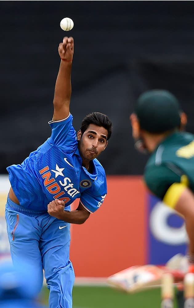 India's Bhuvneshwar Kumar, bowls to Australia's David Warner, during their One Day International cricket match in Melbourne Sunday.