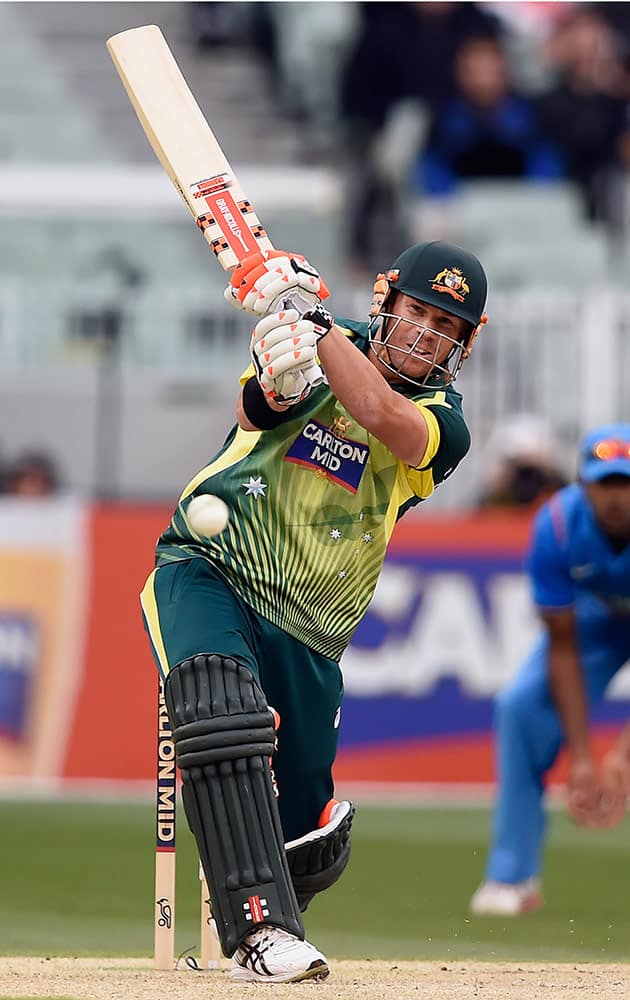 Australia's David Warner hits a drive while batting against India during their One Day International cricket match in Melbourne, Australia, Sunday.