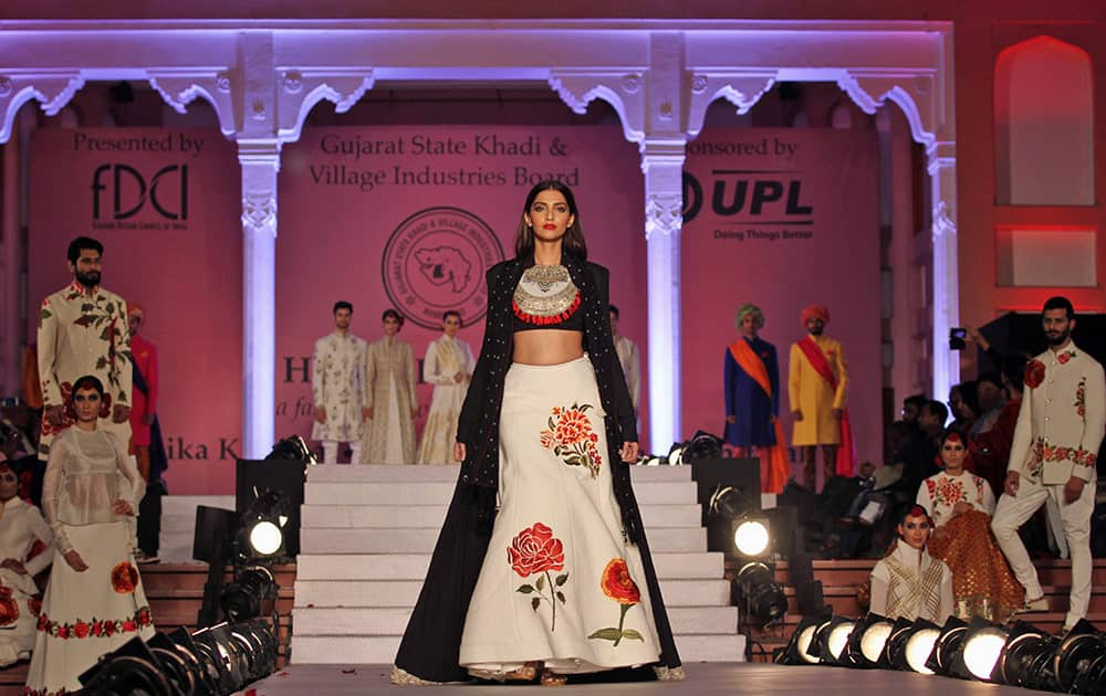 Bollywood actor Sonam Kapoor displays a creation by designer Rohit Bal during a fashion show to promote “Khadi”, or hand-spun fabric in Ahmadabad.