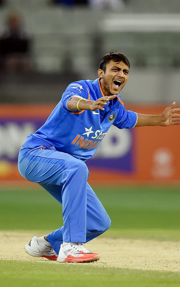 India's Akshar Patel unsucessfully appeals for an LBW against Australia's James Faulkner during their One Day International cricket match in Melbourne, Australia, Sunday.