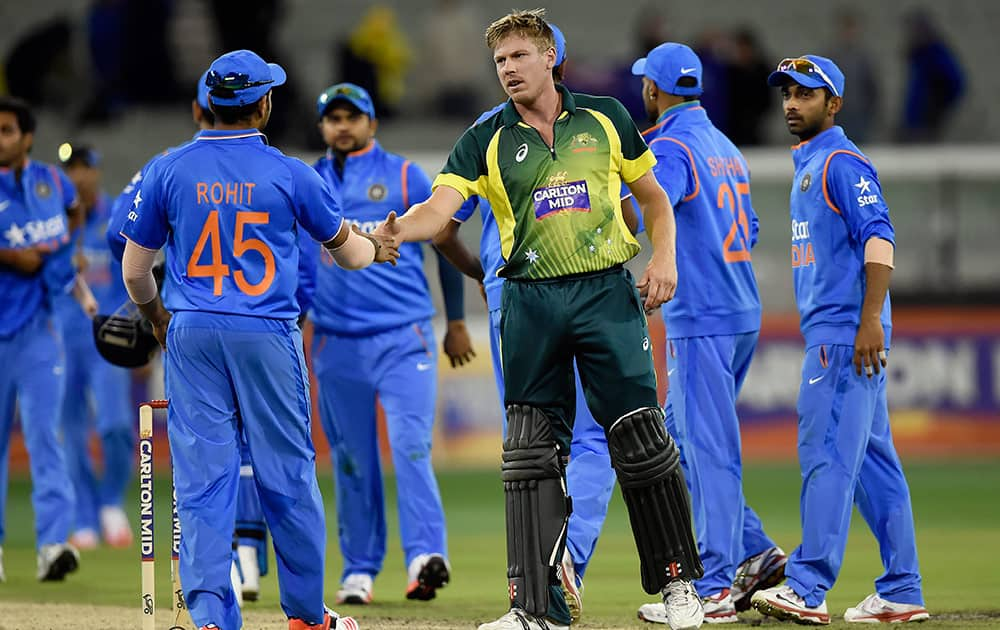 Australia's James Faulkner, shakes hands with Indian players after hitting the winning run during their One Day International cricket match in Melbourne, Australia, Sunday.