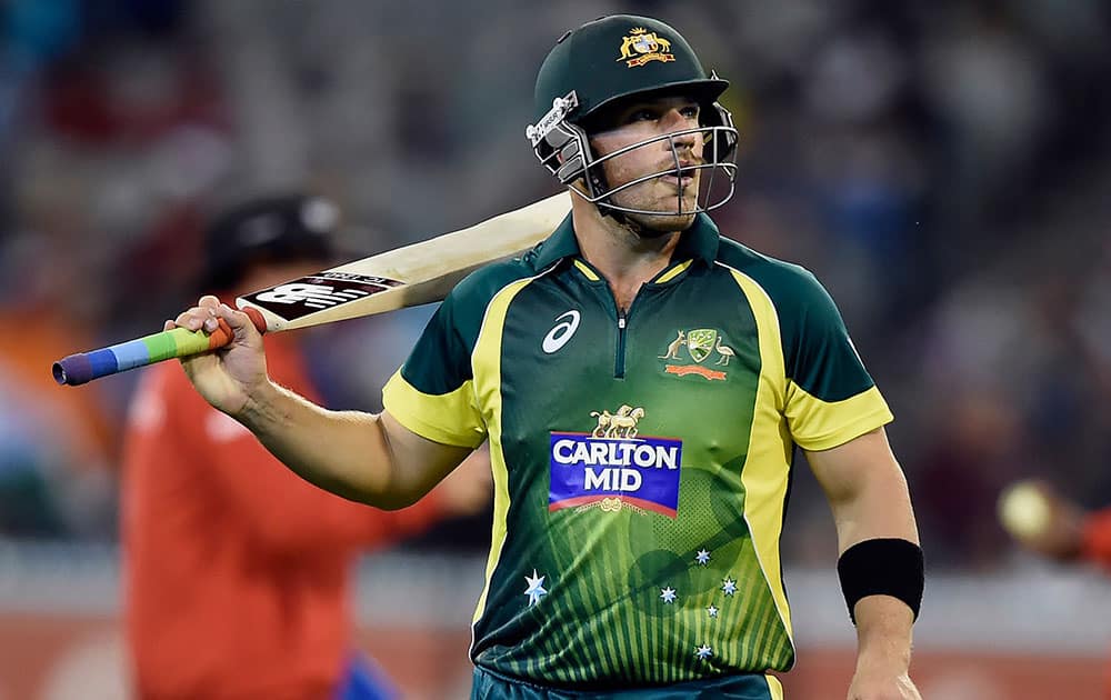 Australia's Aaron Finch walks off the field after going out for 96 runs against India during their One Day International cricket match in Melbourne.