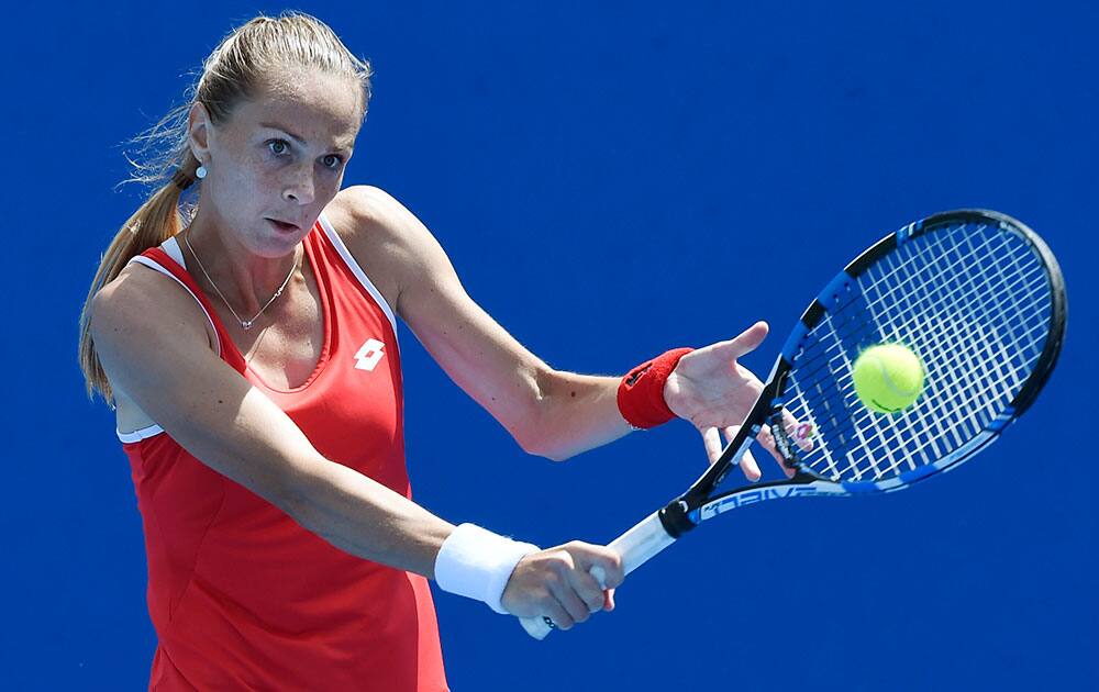 Magdalena Rybarikova of Slovakia makes a backhand Ana Konjuh of Croatia during their first round match at the Australian Open tennis championship in Melbourne.