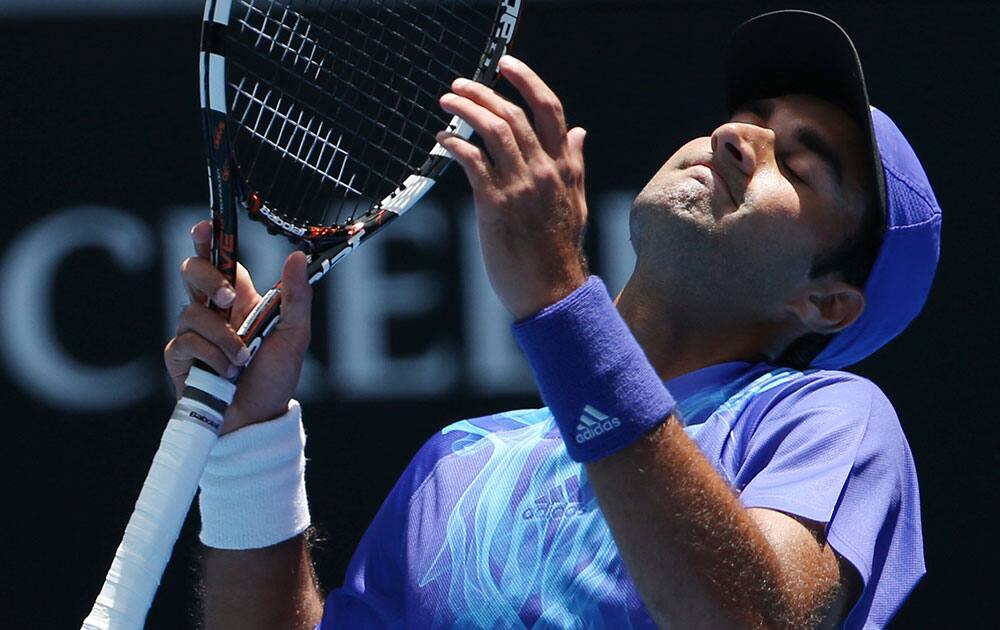 Yuki Bhambri of India reacts to a lost point as he plays Andy Murray of Britain during their first round match at the Australian Open tennis championship in Melbourne.