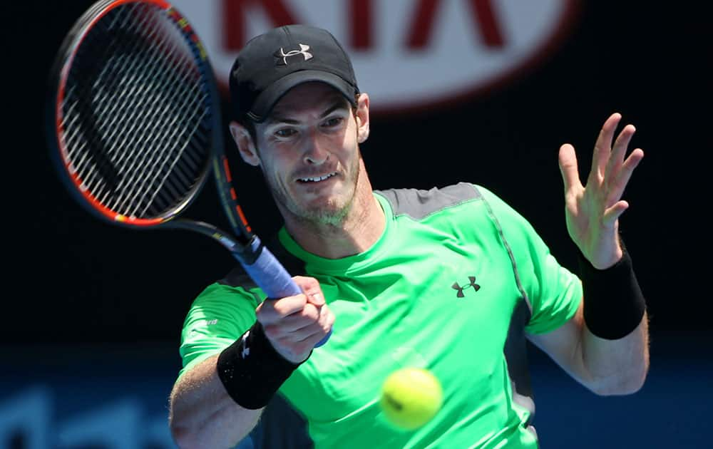 Andy Murray of Britain makes a forehand return to Yuki Bhambri of India during their first round match at the Australian Open tennis championship in Melbourne.