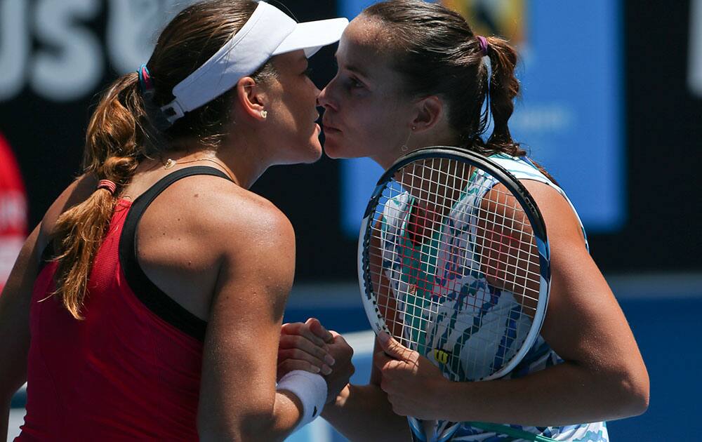 Jarmila Gajdosova of Australia is congratulated by Alexandra Dulgheru, left, of Romania after winning their first round match at the Australian Open tennis championship in Melbourne.