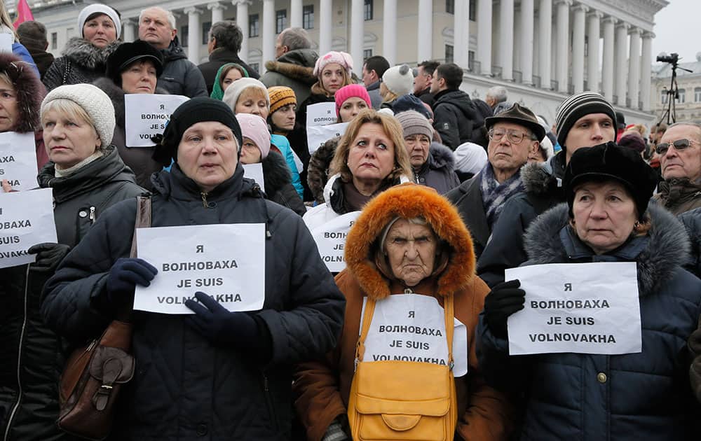 People hold signs that read: 'I am Volnovakha' during a rally on Independence Square in Kiev, Ukraine, in solidarity with the victims of a rocket attack this week that claimed 13 lives on a highway near the eastern town of Volnovakha.
