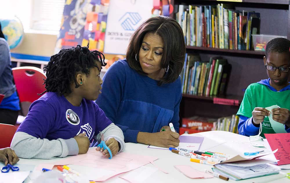 First lady Michelle Obama participates in a service project at the Boys & Girls Club of Greater Washington, to celebrate Martin Luther King, Jr. Day of Service and in honor of Dr. King’s life and legacy, in Washington. 