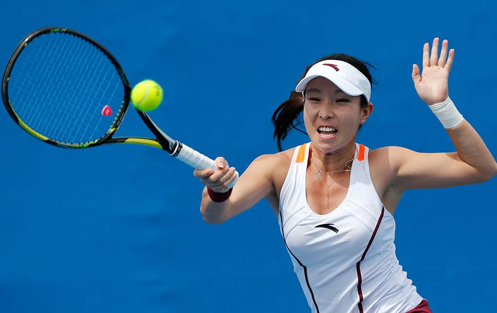 China’s Zheng Jie makes a forehand return to Taiwan’s Chang Kai-Chen during their first round match at the Australian Open tennis championship in Melbourne.