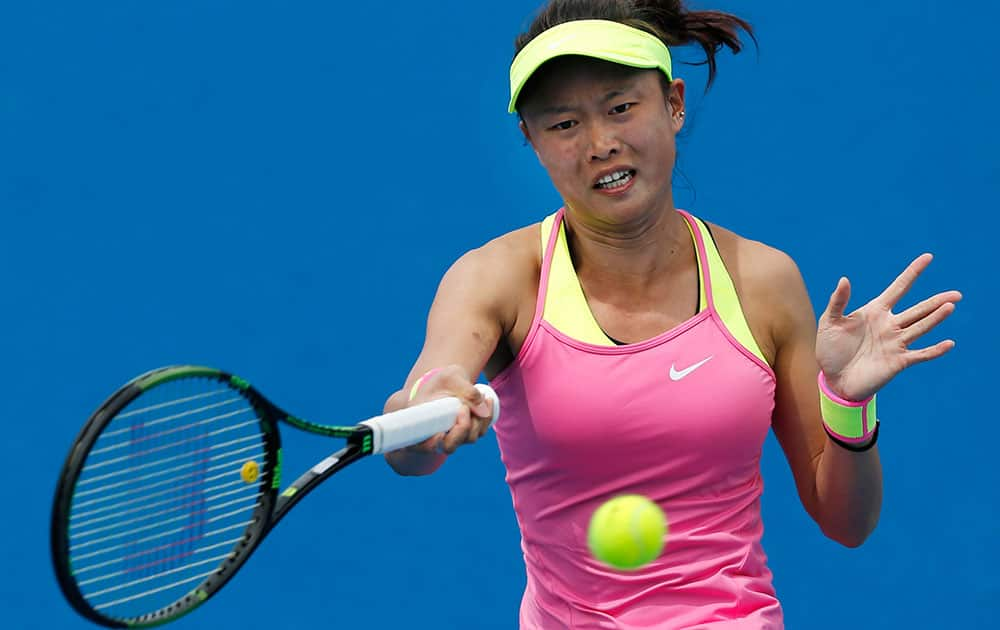 Taiwan’s Chang Kai-Chen makes a forehand return to China’s Zheng Jie during their first round match at the Australian Open tennis championship in Melbourne.