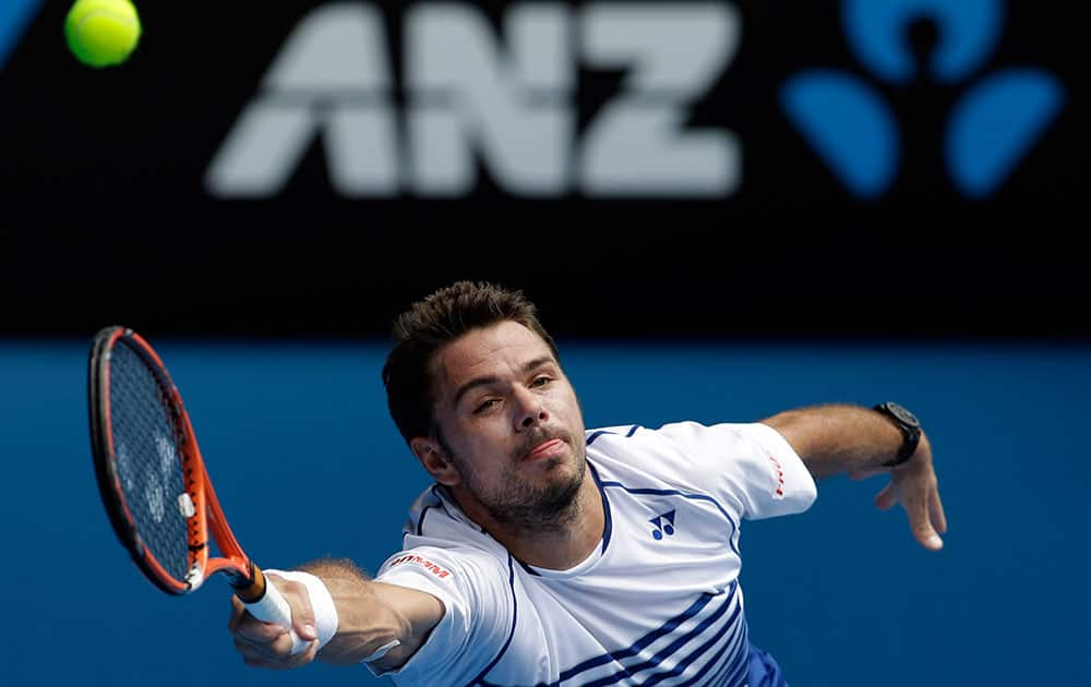 Stan Wawrinka of Switzerland makes a forehand return to Turkey’s Marsel Ilhan during their first round match at the Australian Open tennis championship in Melbourne.