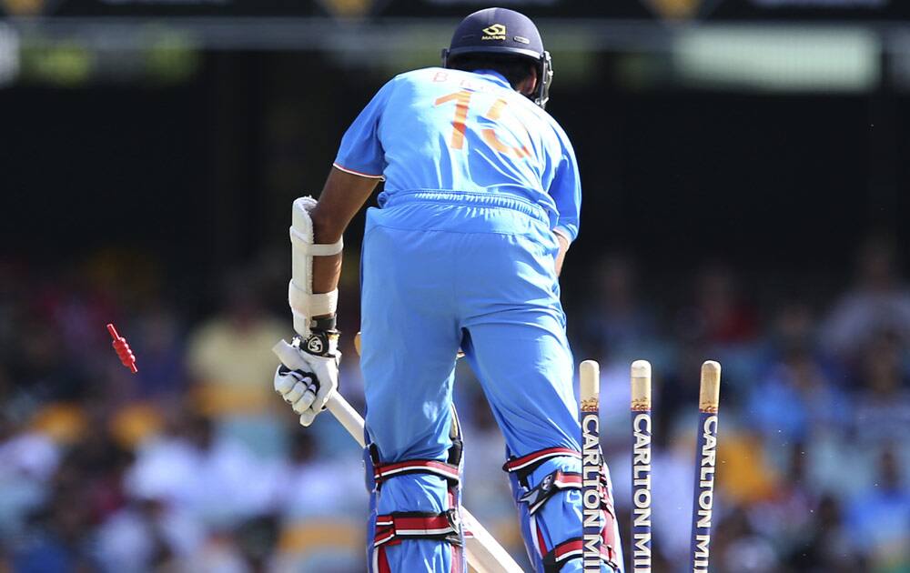 India's Bhuvneshwar Kumar is bowled by England's James Anderson during the one day International cricket match between England and India in Brisbane, Australia.