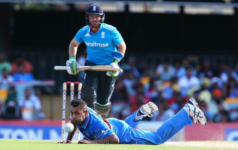 India's Stuart Binny, fails to stop a shot by England's Ian Bell, during the one-day International cricket match between England and India in Brisbane, Australia.