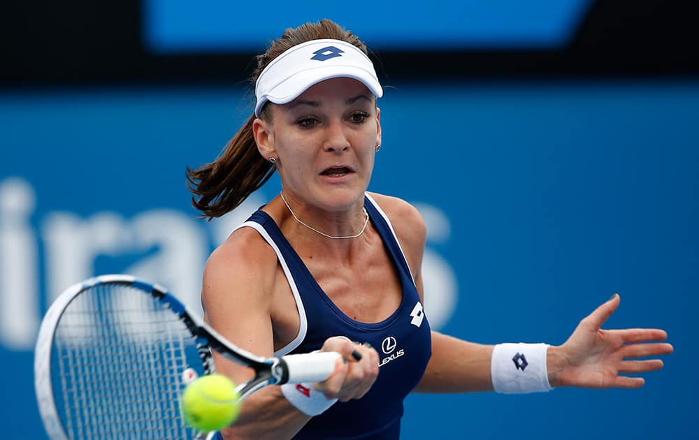 Agnieszka Radwanska of Poland makes a forehand return to Kurumi Nara of Japan during their first round match at the Australian Open tennis championship in Melbourne, Australia.