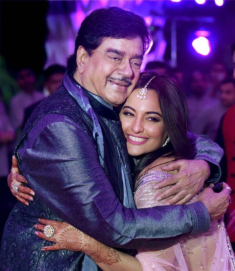 Shatrughan Sinha and his daughter Sonakshi during the wedding reception of his son Kussh and Taruna Agarwal in Mumbai .