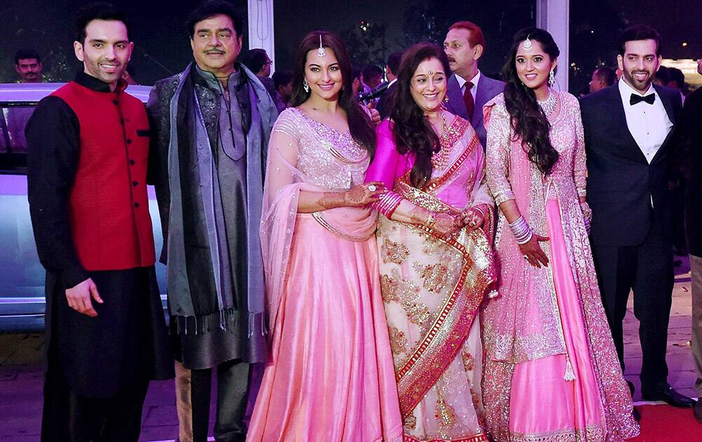 Shatrughan Sinha and his wife Poonam with son Luv and daughter Sonakshi during the wedding reception of their son Kussh and Taruna Agarwal in Mumbai.