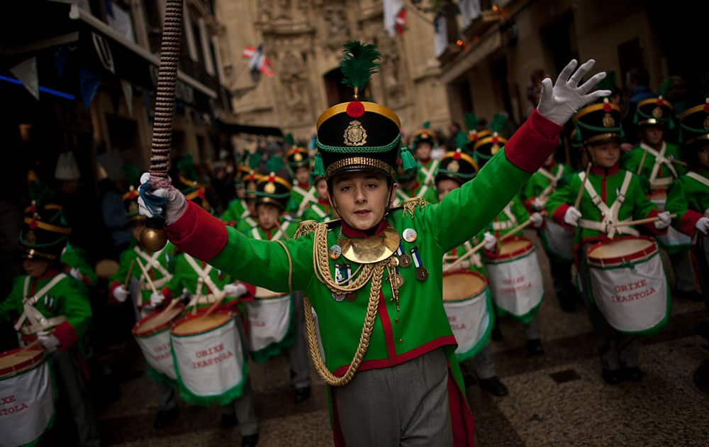  ''Tamborilleros'' wearing their uniforms march in the traditional ' La Tamborrada', during 'El Dia Grande', the main day of San Sebastian feasts, in the Basque city of San Sebastian, northern Spain.