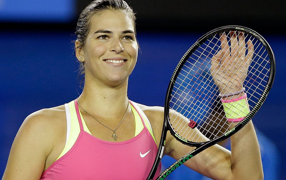 Ajla Tomljanovic of Australia celebrates after defeating Shelby Rogers of the U.S. in their first round match at the Australian Open tennis championship in Melbourne.