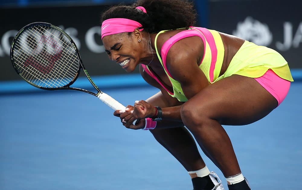 Serena Williams of the US celebrates a point won against Alison Van Uytvanck of Belgium during their first round match at the Australian Open tennis championship in Melbourne.