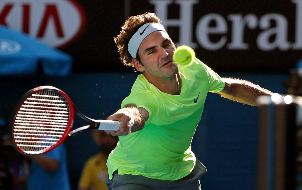 Roger Federer of Switzerland makes a forehand return to Simone Bolelli of Italy during their second round match at the Australian Open tennis championship in Melbourne, Australia.