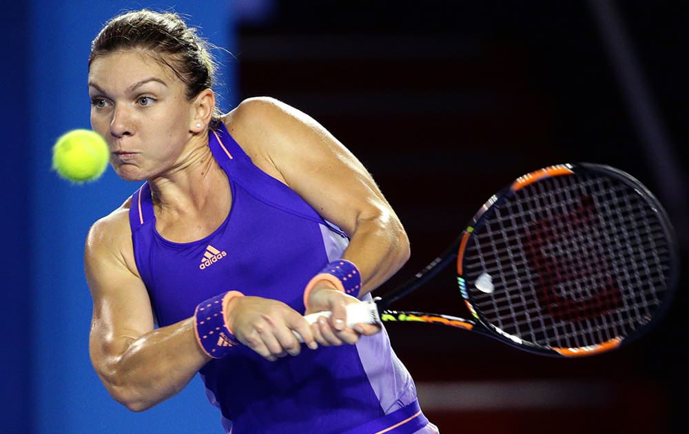 Simona Halep of Romania makes a backhand return to Jarmila Gajdosova of Australia during their second round match at the Australian Open tennis championship in Melbourne.