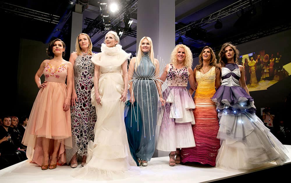 Nazan Eckes, Tatjana Patitz, Eveline Hall, Bonnie Strange, Lavera boss Klara Ahlers, Elisabetta Canalis and Elisa Sednaoui, from left, wear creations of Lavera as part of the Mercedes-Benz Fashion Week.