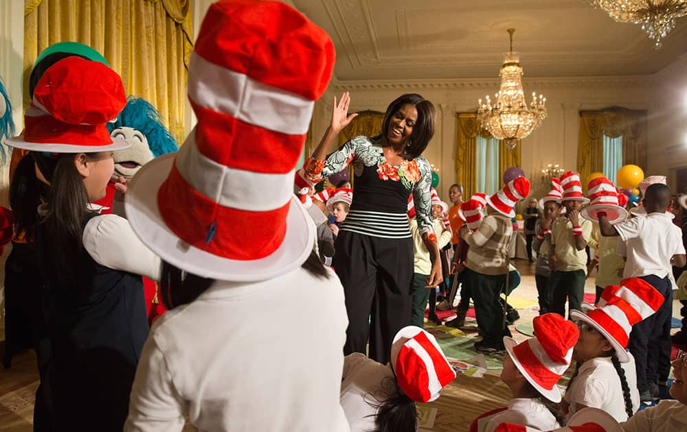 First lady Michelle Obama greets local students after reading to them as part of her 