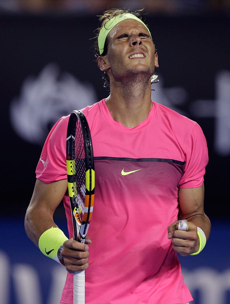 Rafael Nadal of Spain celebrates a point won against Tim Smyczek of the U.S. during their second round match at the Australian Open tennis championship in Melbourne.