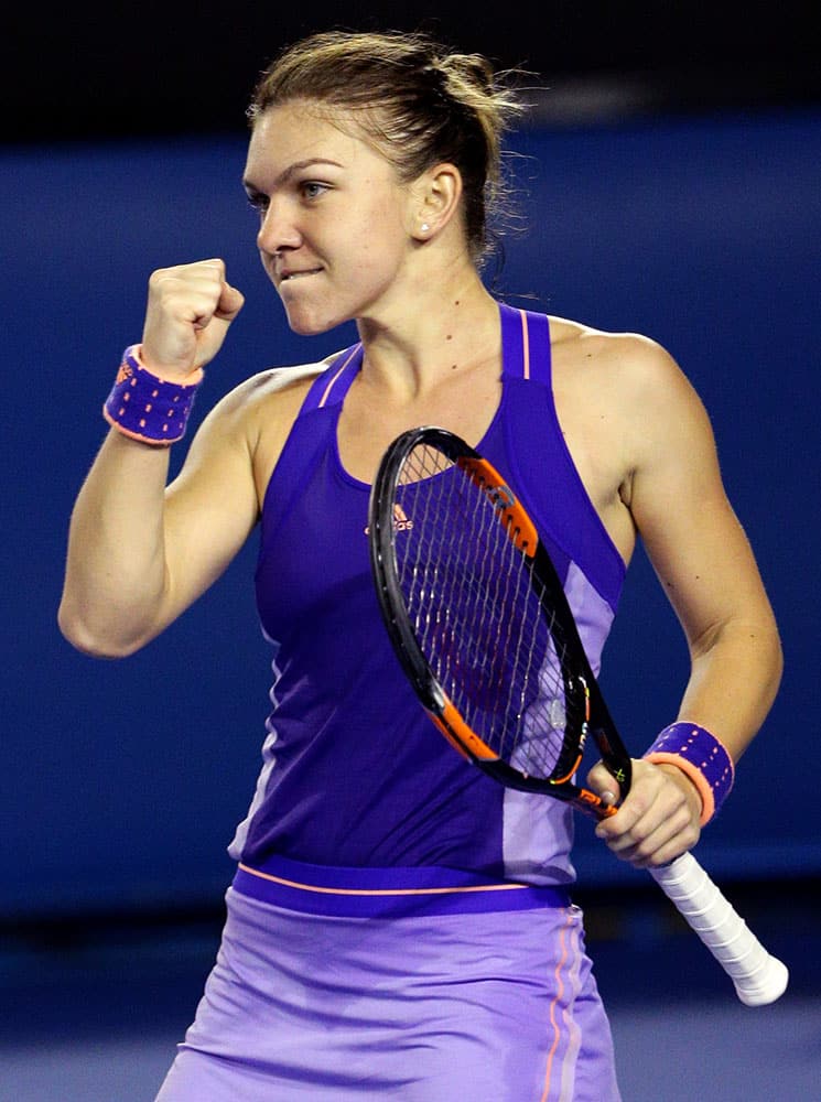 Simona Halep of Romania celebrates after defeating Jarmila Gajdosova of Australia during their second round match at the Australian Open tennis championship in Melbourne.