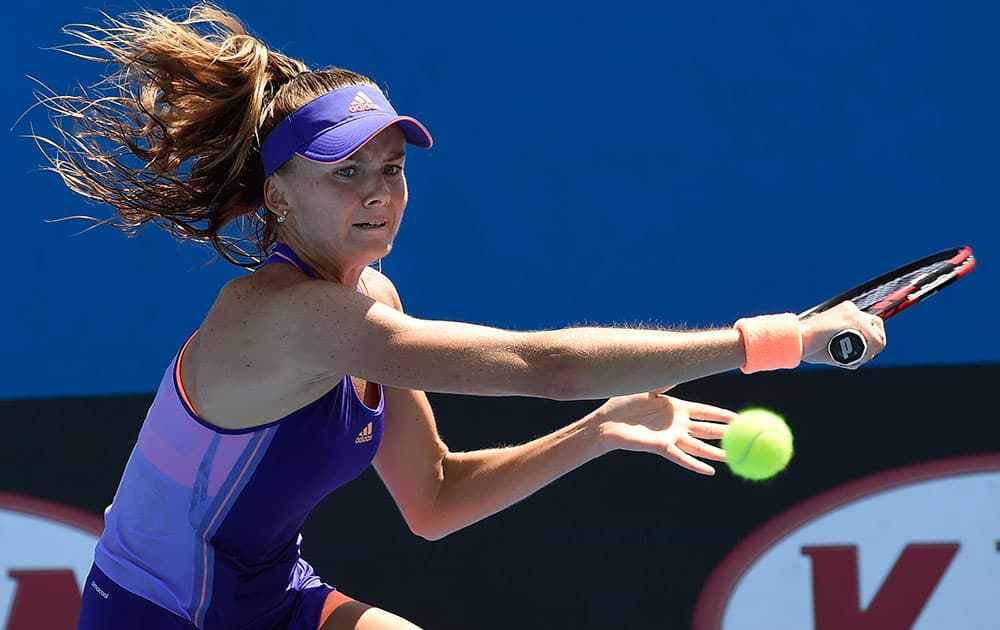 Daniela Hantuchova of Slovakia makes a backhand return to Garbine Muguruza of Spain during their second round match at the Australian Open tennis championship in Melbourne.