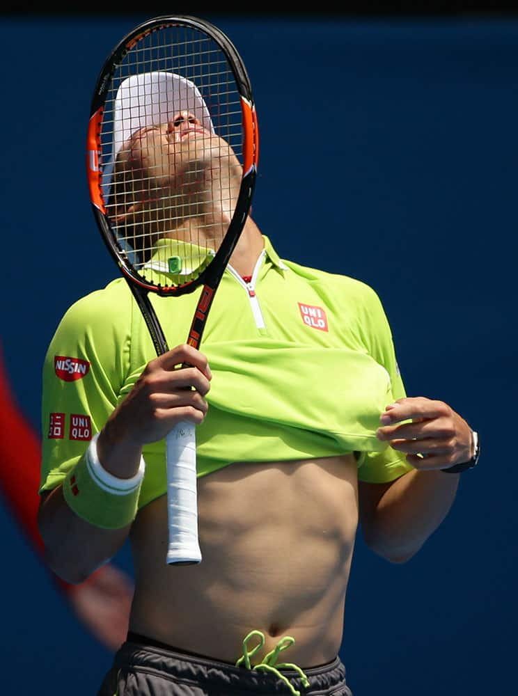 Kei Nishikori of Japan reacts to a lost point as he plays Ivan Dodig of Croatia during their second round match at the Australian Open tennis championship in Melbourne.