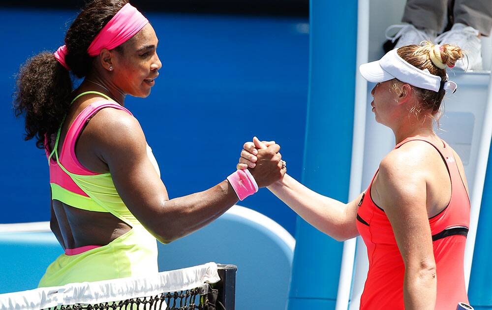 Serena Williams of the US, left, shakes hands with Vera Zvonareva of Russia after winning their second round match at the Australian Open tennis championship in Melbourne.