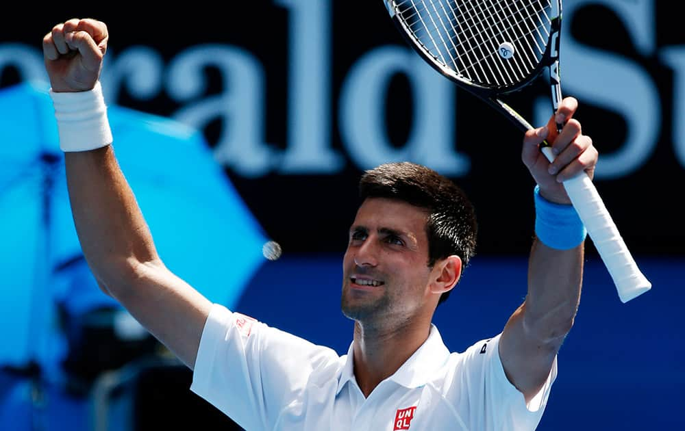 Novak Djokovic of Serbia waves to the crowd following his scone round win over Andrey Kuznetsov of Russia at the Australian Open tennis championship in Melbourne, Australia.