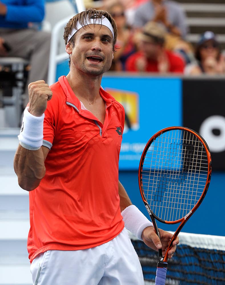 David Ferrer of Spain celebrates after defeating Sergiy Stakhovsky of Ukraine during their second round match at the Australian Open tennis championship in Melbourne, Australia.