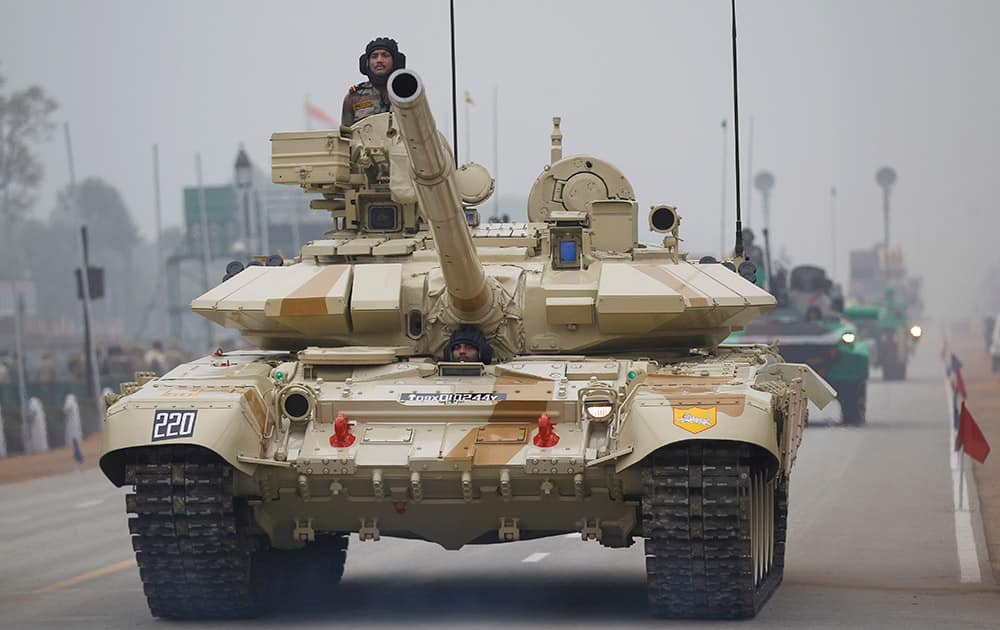 A T-90 tank rolls down Rajpath during rehearsals for the upcoming Republic Day parade in New Delhi.