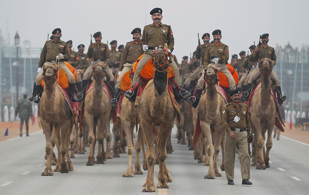 Camel mounted Indian Border Security Force soldiers ride during rehearsals for the upcoming Republic Day parade in New Delhi.