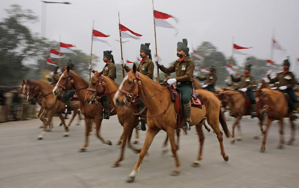 Horse mounted Indian presidential bodyguards participate in rehearsals for the upcoming Republic Day parade in New Delhi.