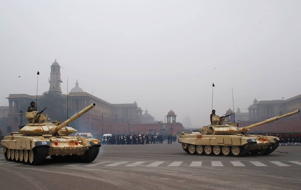 T-90 tanks roll out during a practice session ahead of Republic Day parade in New Delhi.