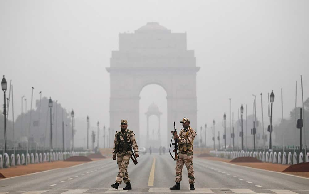 Indian paramilitary soldiers stand guard during rehearsals for the upcoming Republic Day parade in New Delhi.