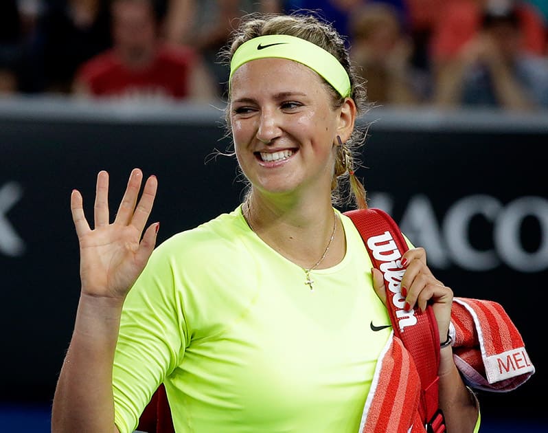 Victoria Azarenka of Belarus waves after defeating Caroline Wozniacki of Denmark in their second round match at the Australian Open tennis championship in Melbourne.