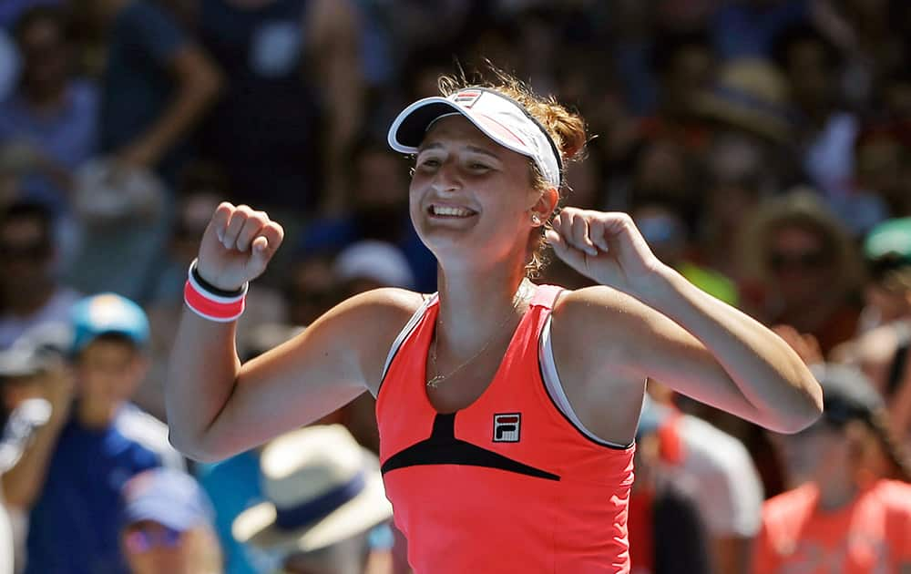 Irina-Camelia Begu of Romania celebrates after defeating Carina Witthoeft of Germany in their third round match at the Australian Open tennis championship in Melbourne.