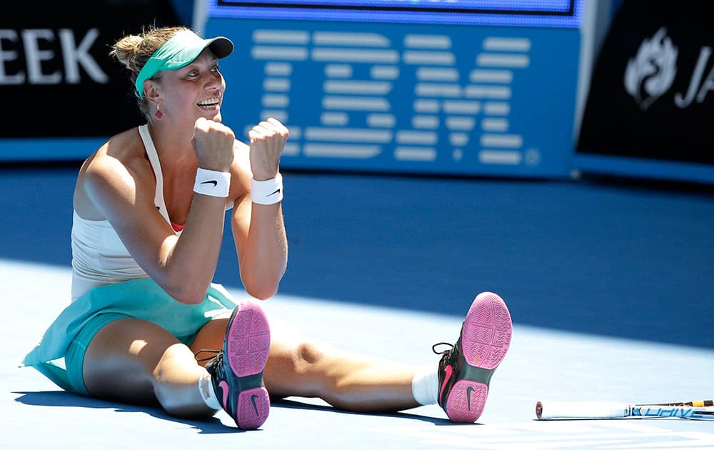 Yanina Wickmayer of Belgium celebrates after defeating Sara Errani of Italy during their third round match at the Australian Open tennis championship in Melbourne.