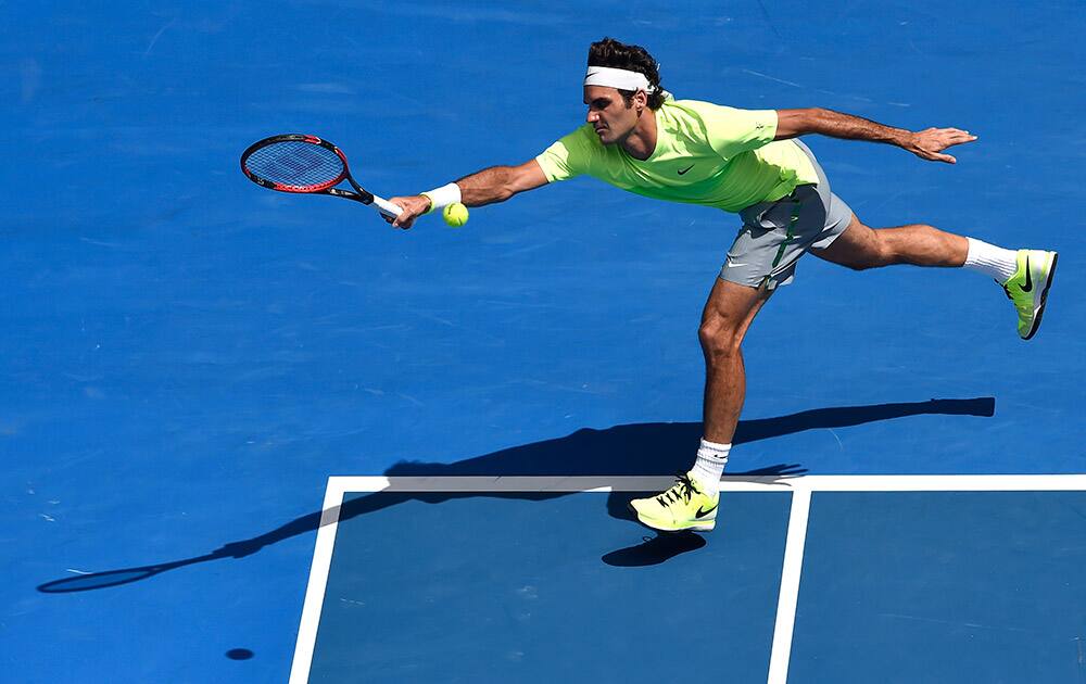 Roger Federer of Switzerland reaches out for a shot to Andreas Seppi of Italy during their third round match at the Australian Open tennis championship in Melbourne.