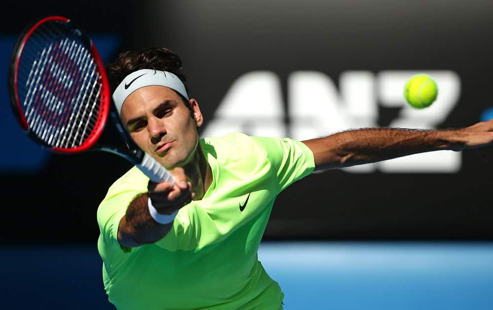 Roger Federer of Switzerland makes a forehand return to Andreas Seppi of Italy during their third round match at the Australian Open tennis championship in Melbourne, Australia.