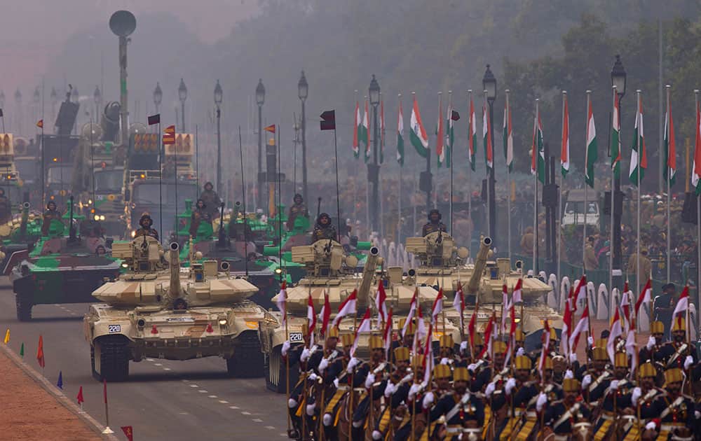 T-90 tanks roll down Rajpath, a ceremonial boulevard that runs from Indian President's palace to war memorial India Gate, as part of the full dress rehearsal ahead of Republic Day parade in New Delhi.