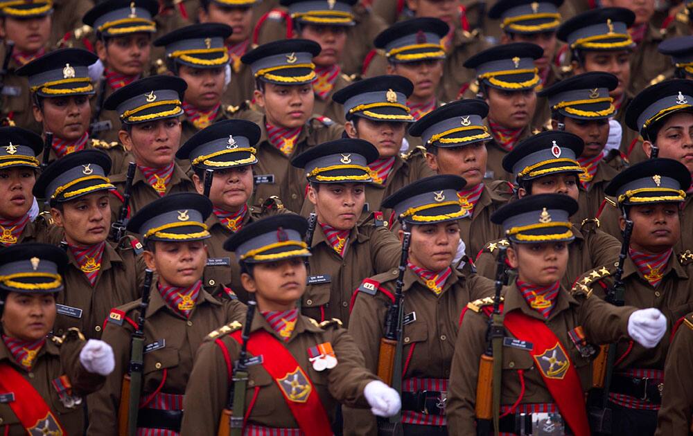 Women soldiers march down Rajpath, a ceremonial boulevard that runs from Indian President's palace to war memorial India Gate, during the full dress rehearsal ahead of Republic Day parade in New Delhi.