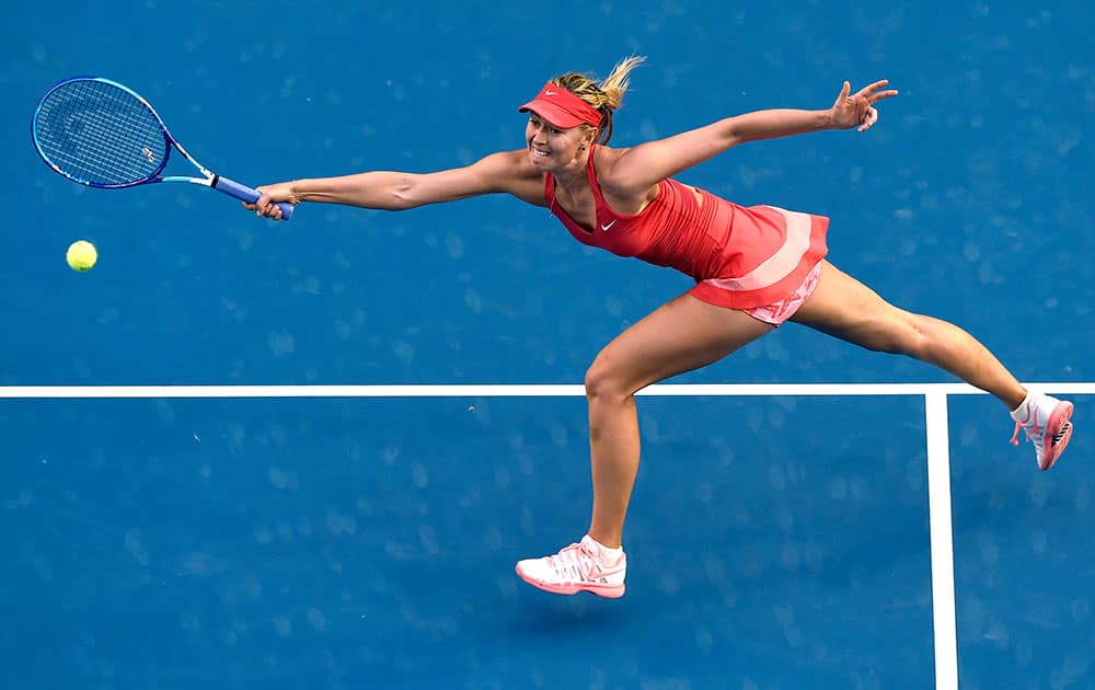 Maria Sharapova of Russia stretches out for a shot to Zarina Diyas of Kazakhstan during their third round match at the Australian Open tennis championship in Melbourne, Australia.