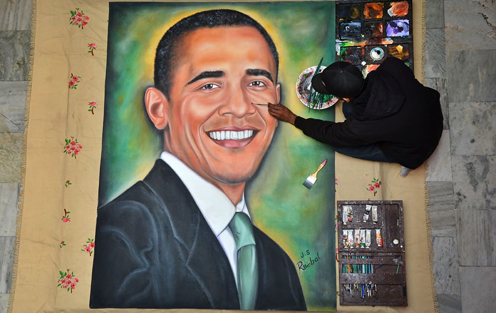 Jagjot Singh Rubal gives final touches on a painting of US President Barack Obama in Amritsar. Obama arrives in New Delhi on Sunday and will be the first American president to attend India’s annual Republic Day festivities marked annually on Jan. 26.