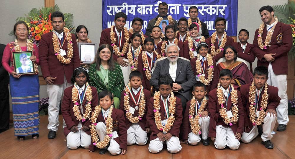 Prime Minister Narendra Modi poses for a group photo with the children, who won the National Awards for Bravery 2014, in New Delhi.